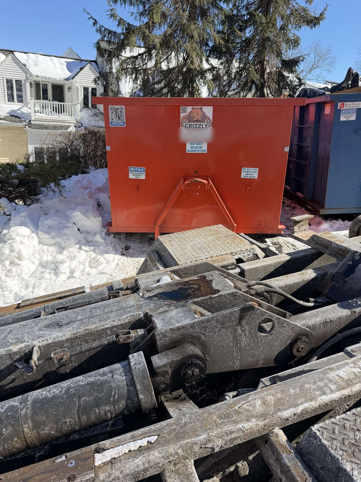 dumpster with metal debris by Grizzly Junk Pros